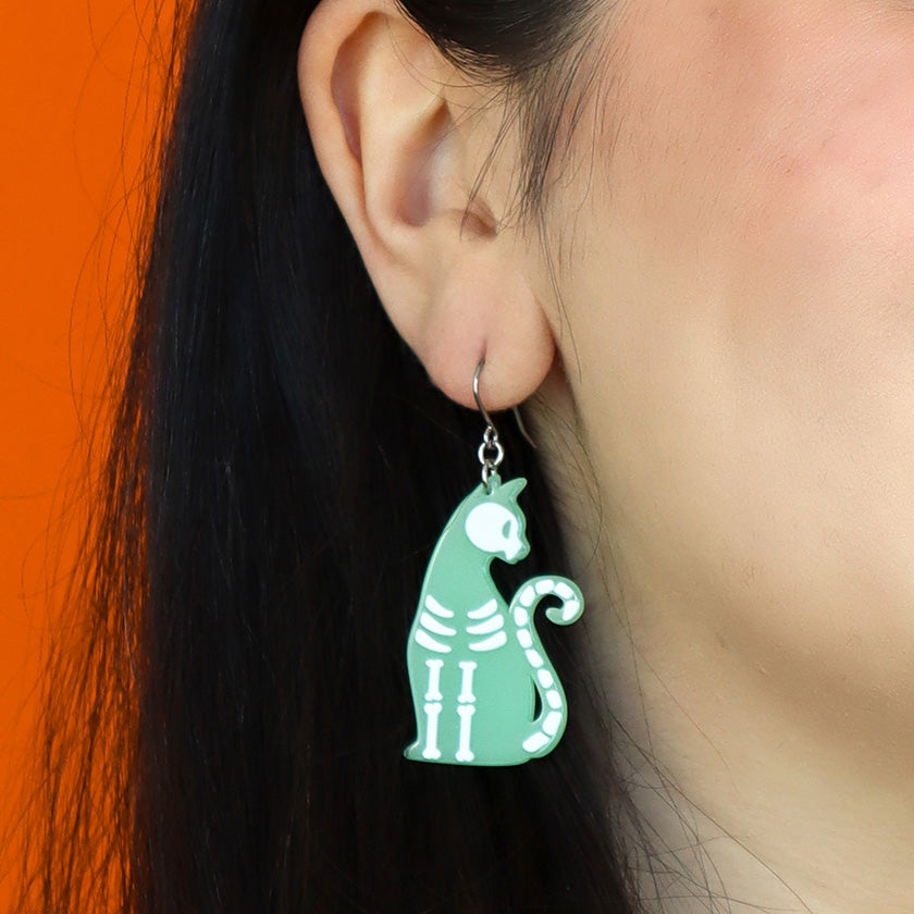 Erstwilder - Bone Kitty Drop Earrings in Glow in the Dark